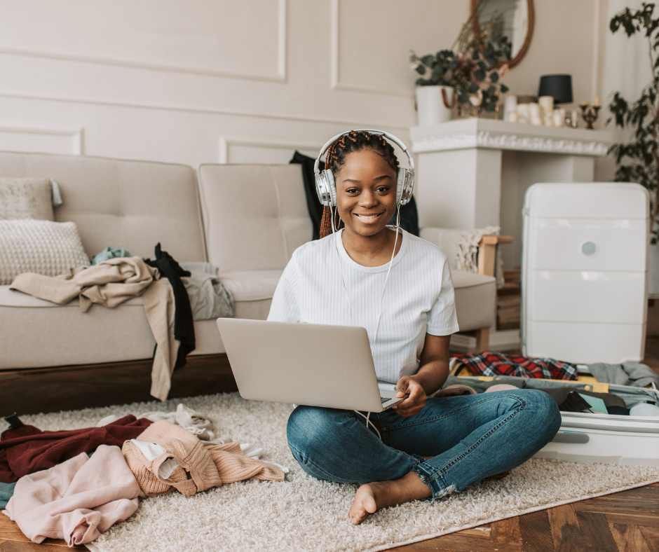 A confident entrepreneur standing in a bright, modern workspace or holding a phone/laptop—with branding colors subtly integrated. 